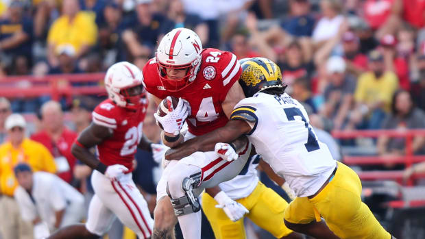 Thomas Fidone is tackled after making a catch for 17 yards and a first down during the fourth quarter against Michigan in 2023.
